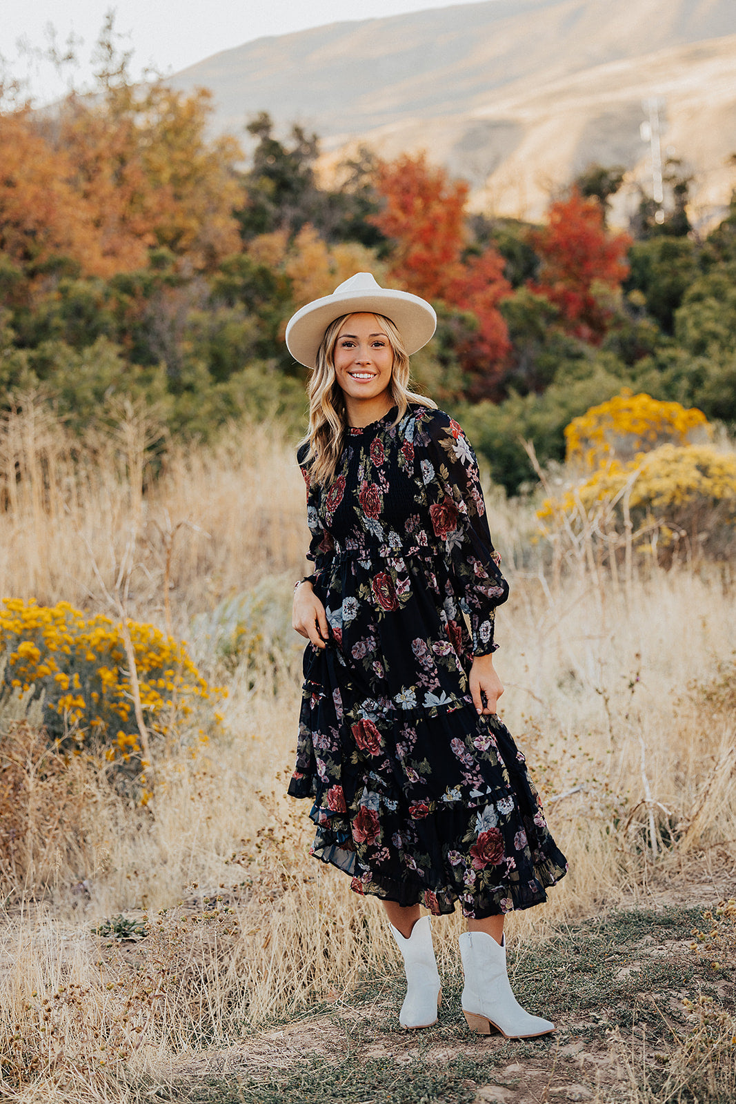 THE LAICEE SMOCKED FLORAL DRESS IN BLACK