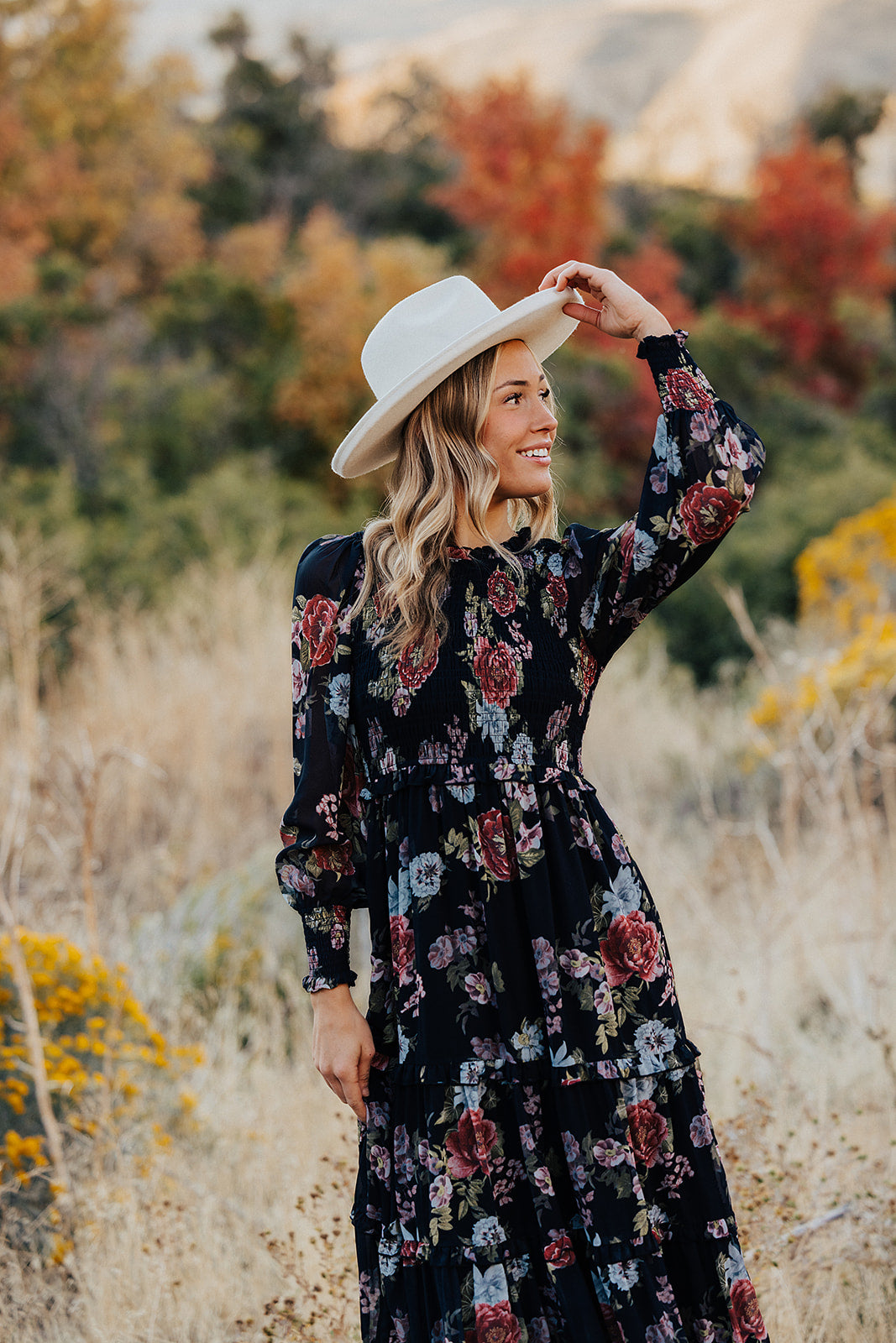 THE LAICEE SMOCKED FLORAL DRESS IN BLACK