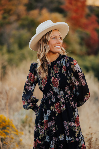 THE LAICEE SMOCKED FLORAL DRESS IN BLACK