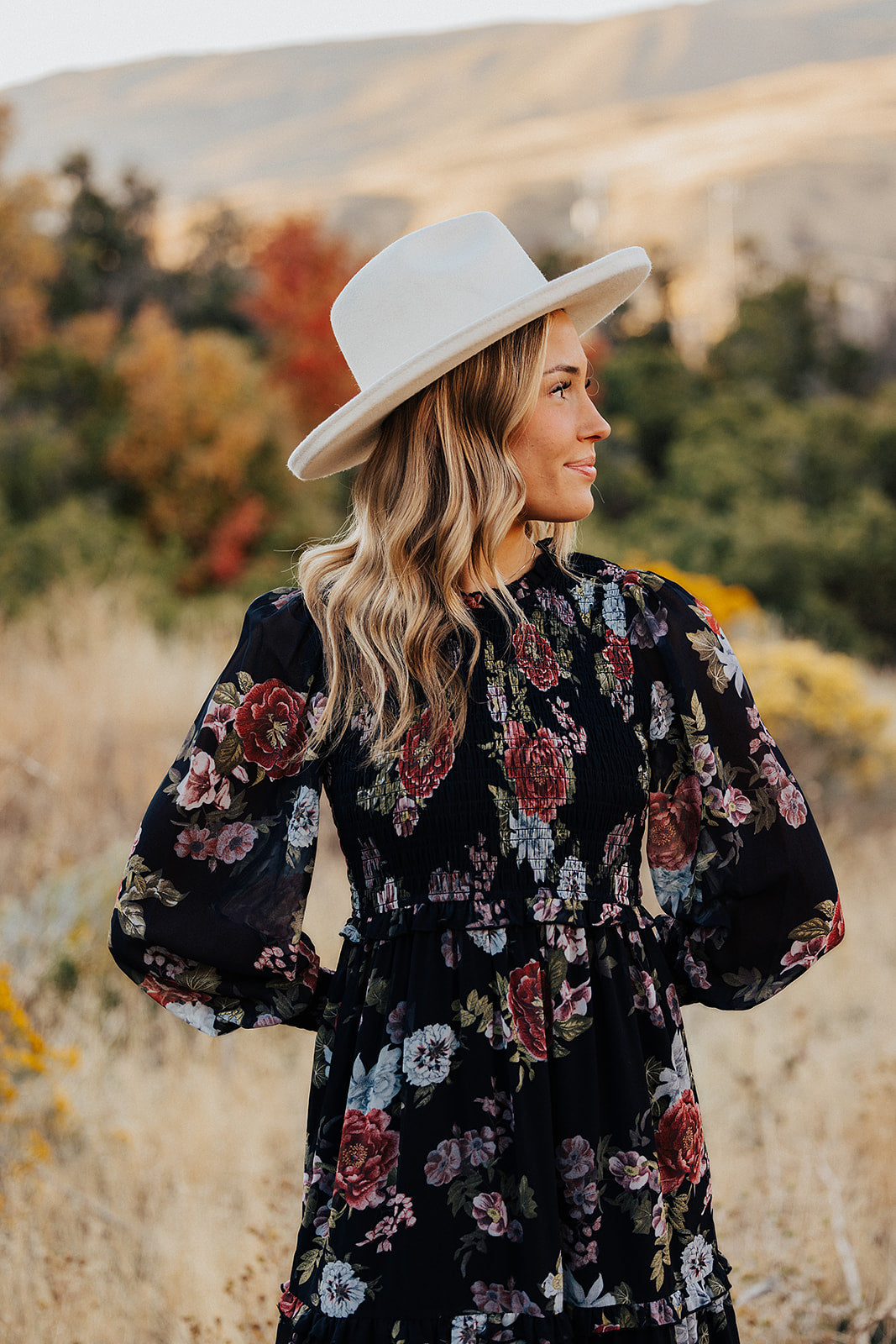 THE LAICEE SMOCKED FLORAL DRESS IN BLACK