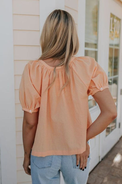 THE MINNIE CHECKERED BUTTON UP BLOUSE IN CORAL