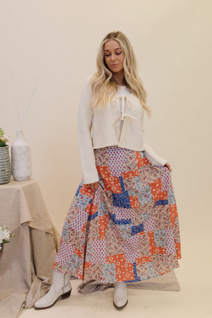 THE BRADYN PRINT MAXI SKIRT IN ORANGE