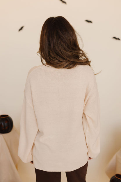 THE PUMPKIN EMBROIDERED KNIT SWEATER IN CREAM