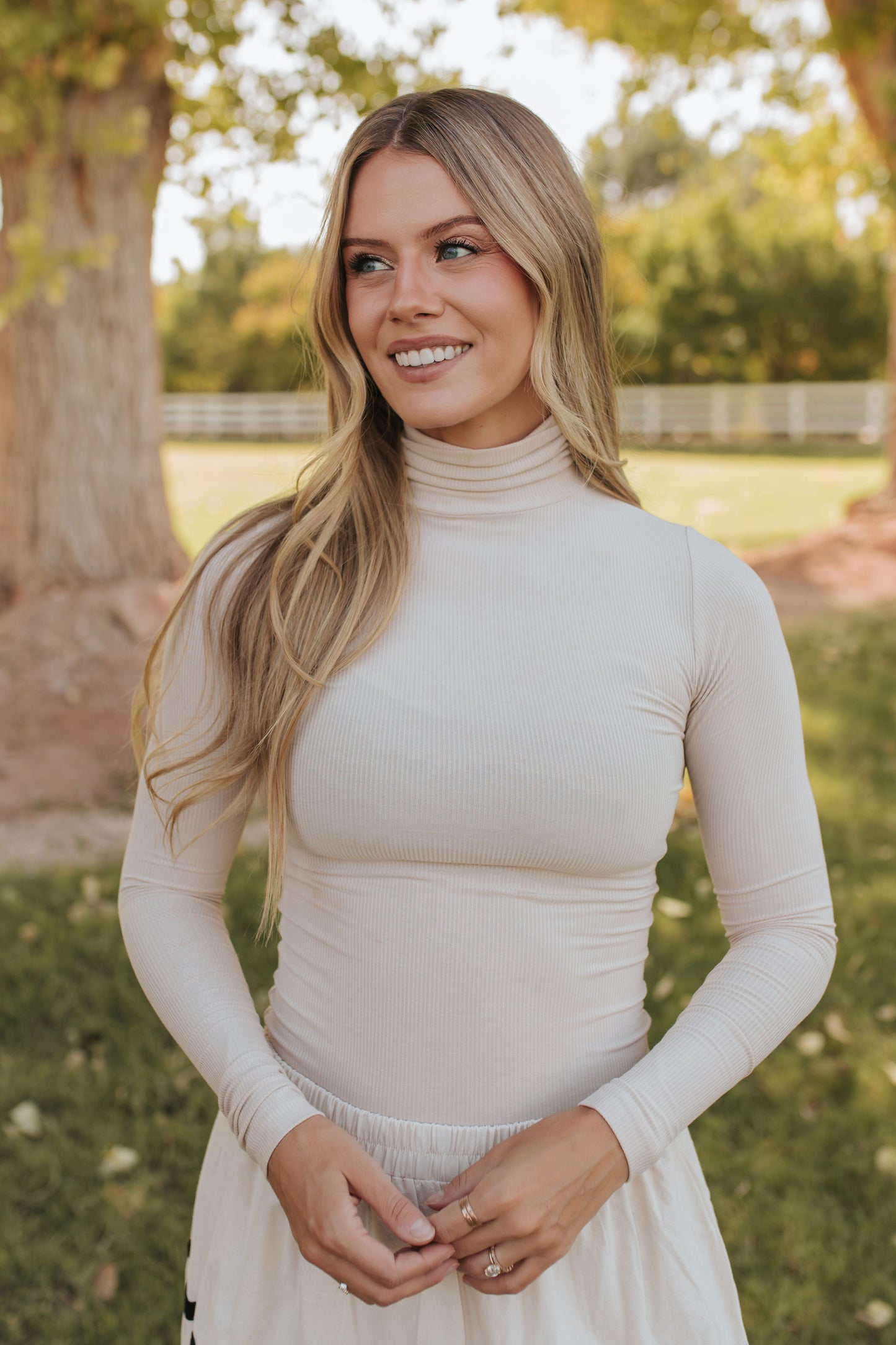 THE CONNER RIBBED TURTLENECK IN TAUPE