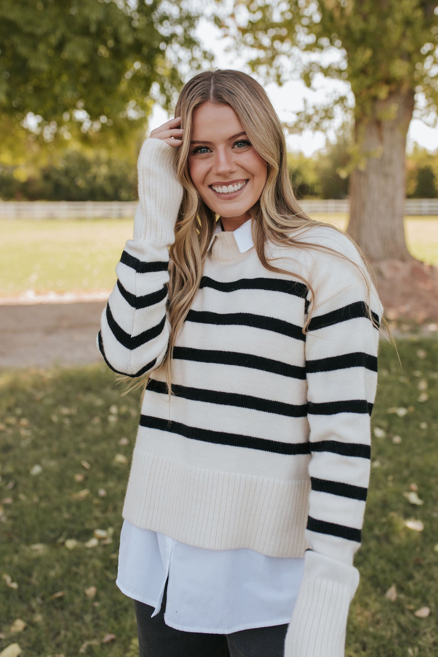 THE JESSI STRIPED MOCK NECK SWEATER IN CREAM