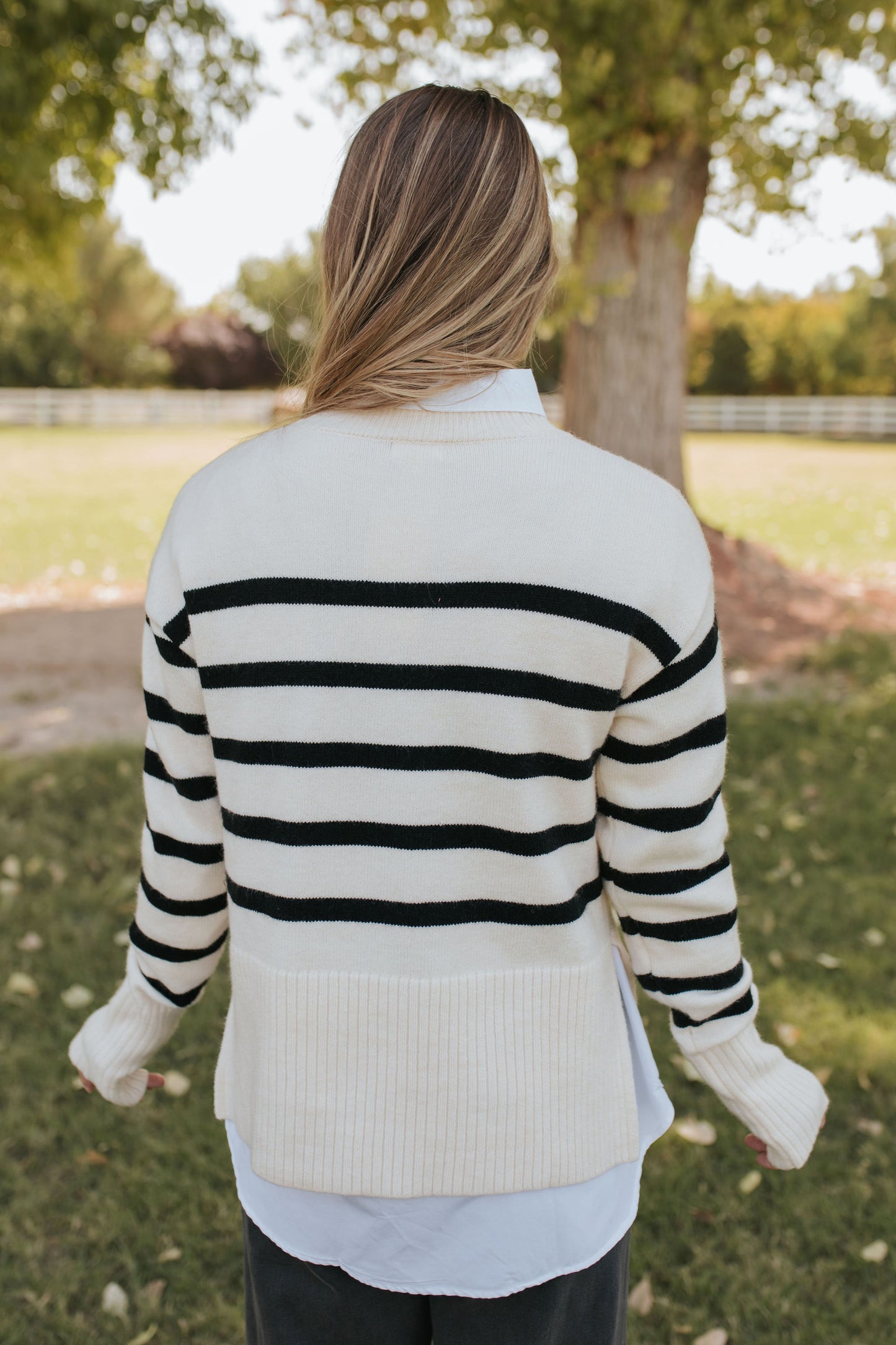 THE JESSI STRIPED MOCK NECK SWEATER IN CREAM