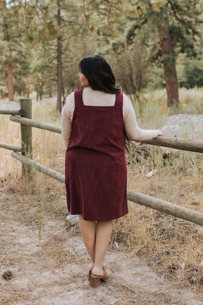 THE BLAKE OVERALL DRESS IN BURGUNDY CORDUROY BY PINK DESERT