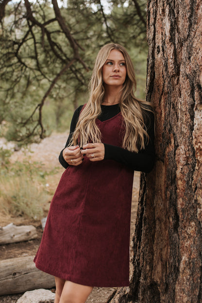 THE BLAKE OVERALL DRESS IN BURGUNDY CORDUROY BY PINK DESERT