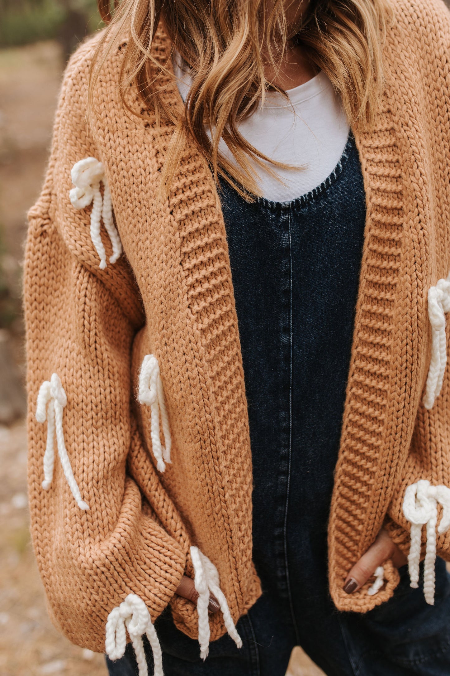 THE CHUNKY BOW KNIT CARDIGAN IN CAMEL