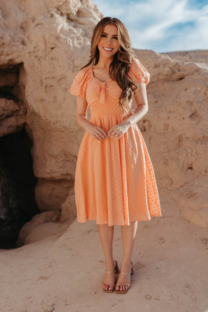 THE PAISLEY TIE FRONT SWISS DAISY DRESS IN PEACHY PEACH BY PINK DESERT