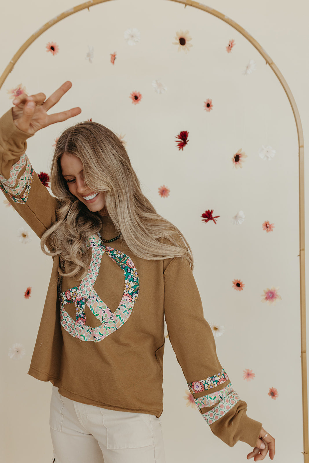 THE PORSCHA PEACE PATCH LONG SLEEVE TOP IN BRONZE