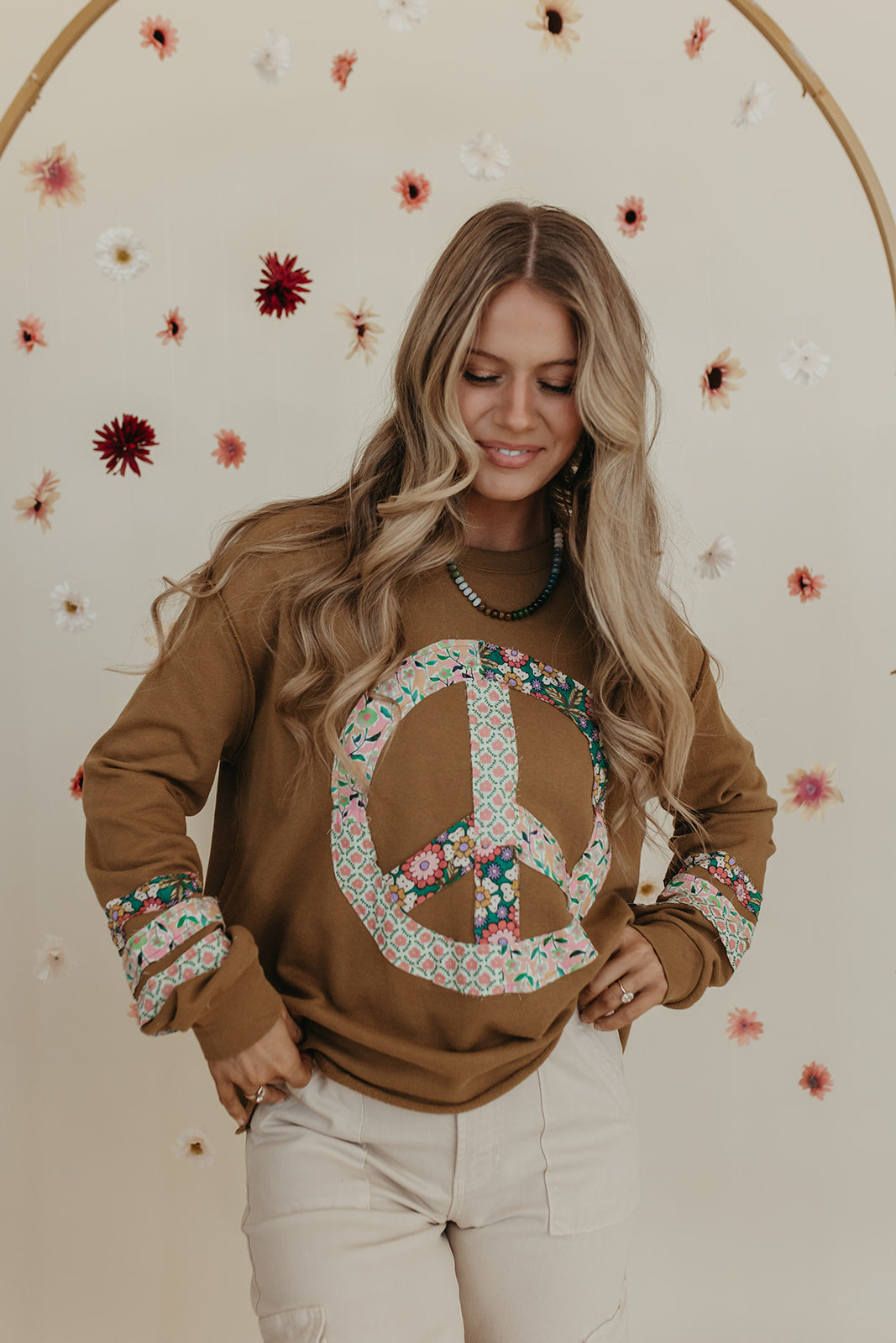 THE PORSCHA PEACE PATCH LONG SLEEVE TOP IN BRONZE