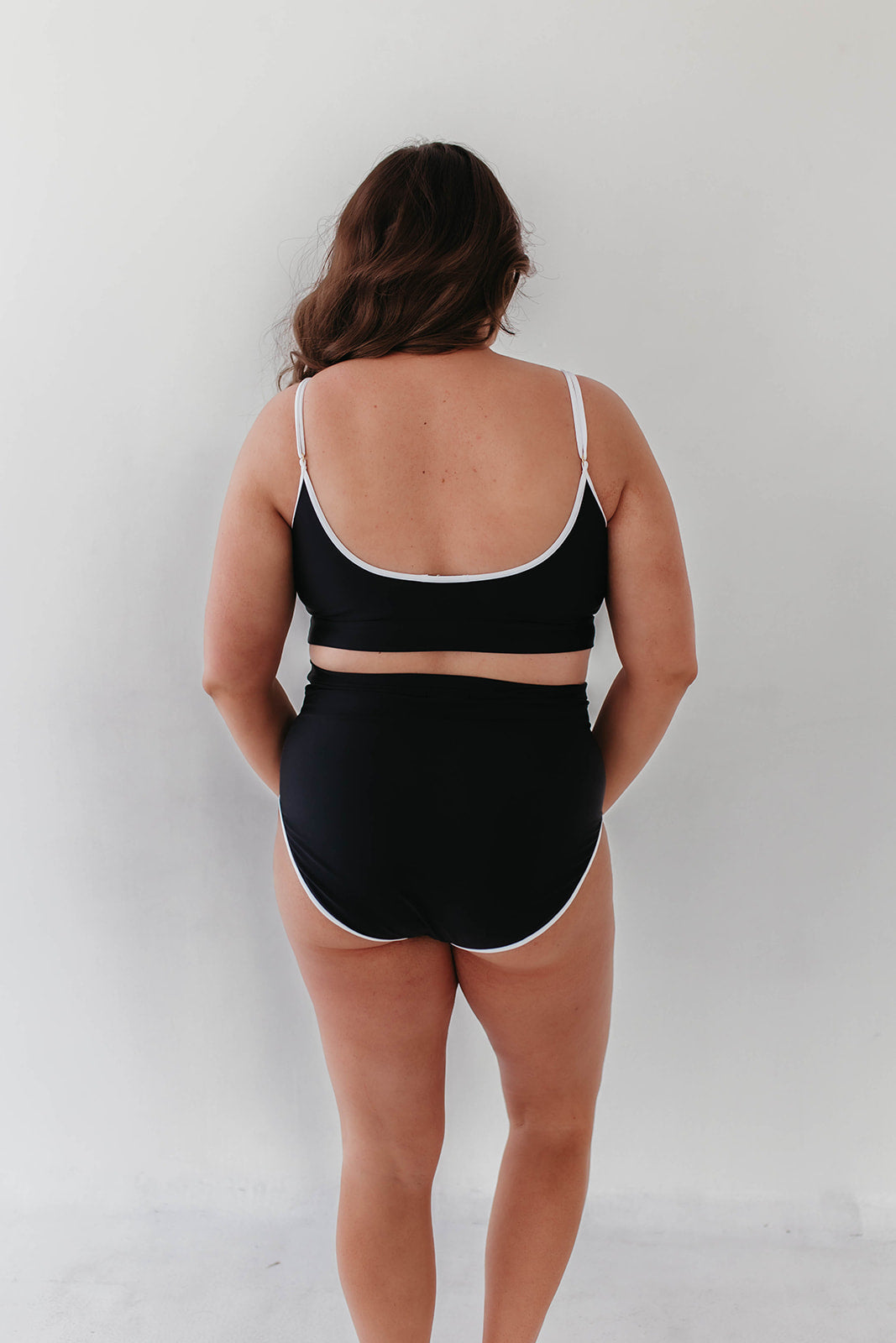 Black swimsuit white trim on sale