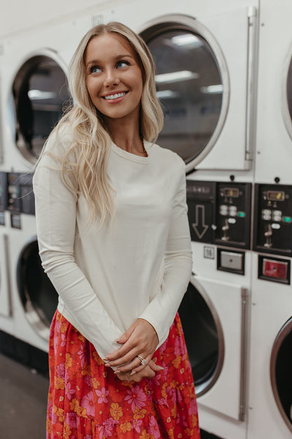 THE LAUREN CURVED HEM LONG SLEEVE TOP IN CREAM