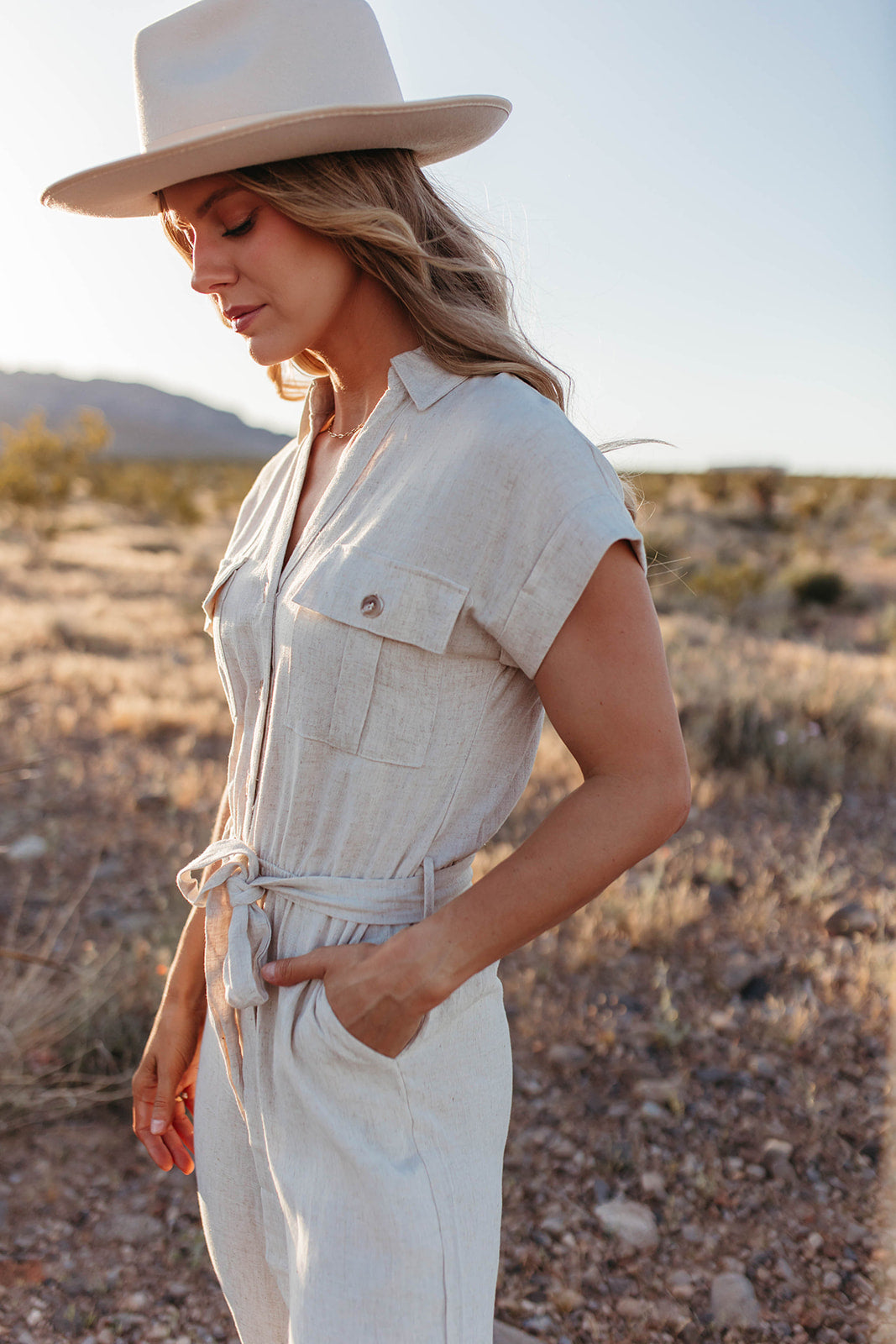 THE KARINA BUTTON DOWN BELTED JUMPSUIT IN NATURAL