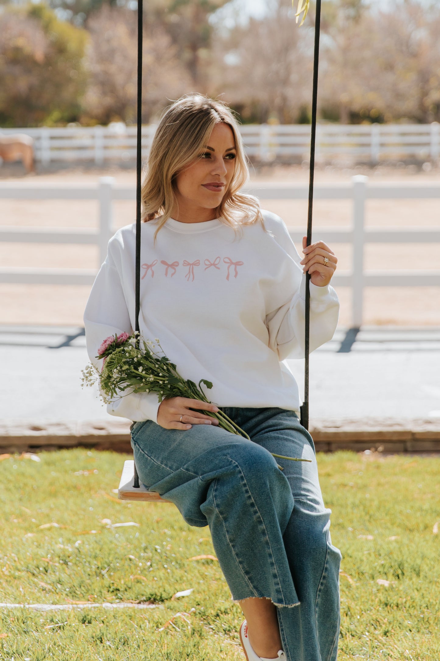 THE EMBROIDERED HOLIDAY BOW PULLOVER IN PINK