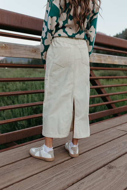 THE CODIE CORDUROY MIDI SKIRT IN CREAM