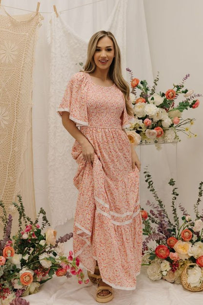 THE DANA SMOCKED MAXI DRESS IN CORAL