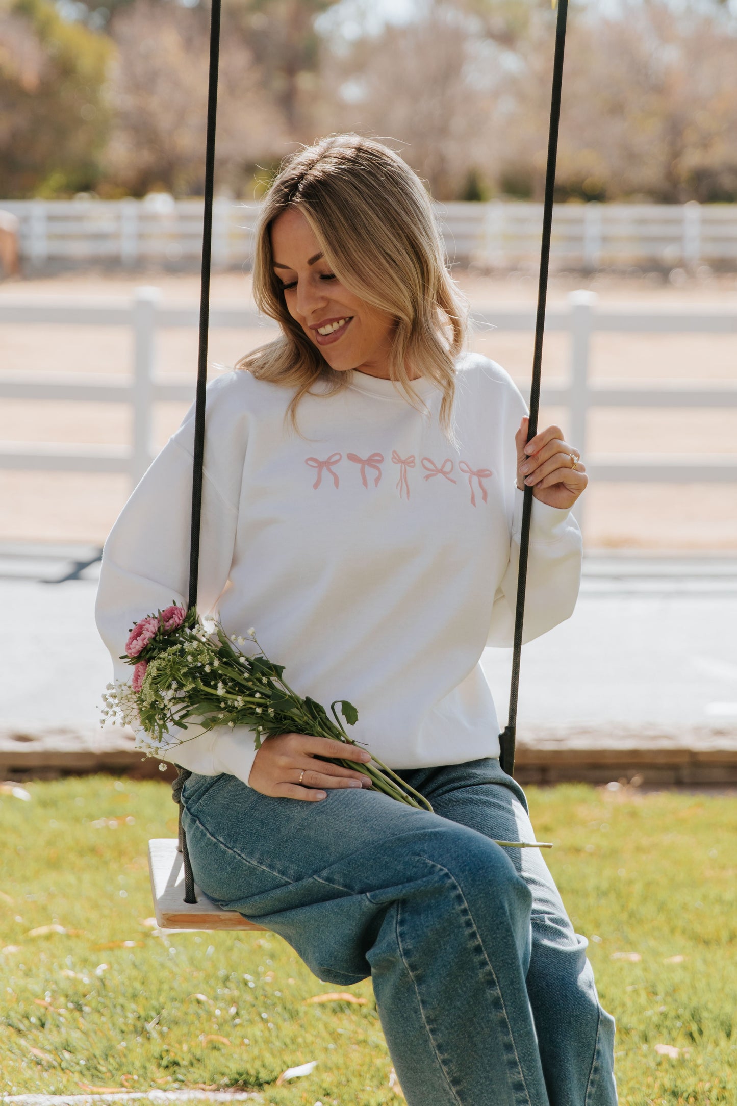 THE EMBROIDERED HOLIDAY BOW PULLOVER IN PINK