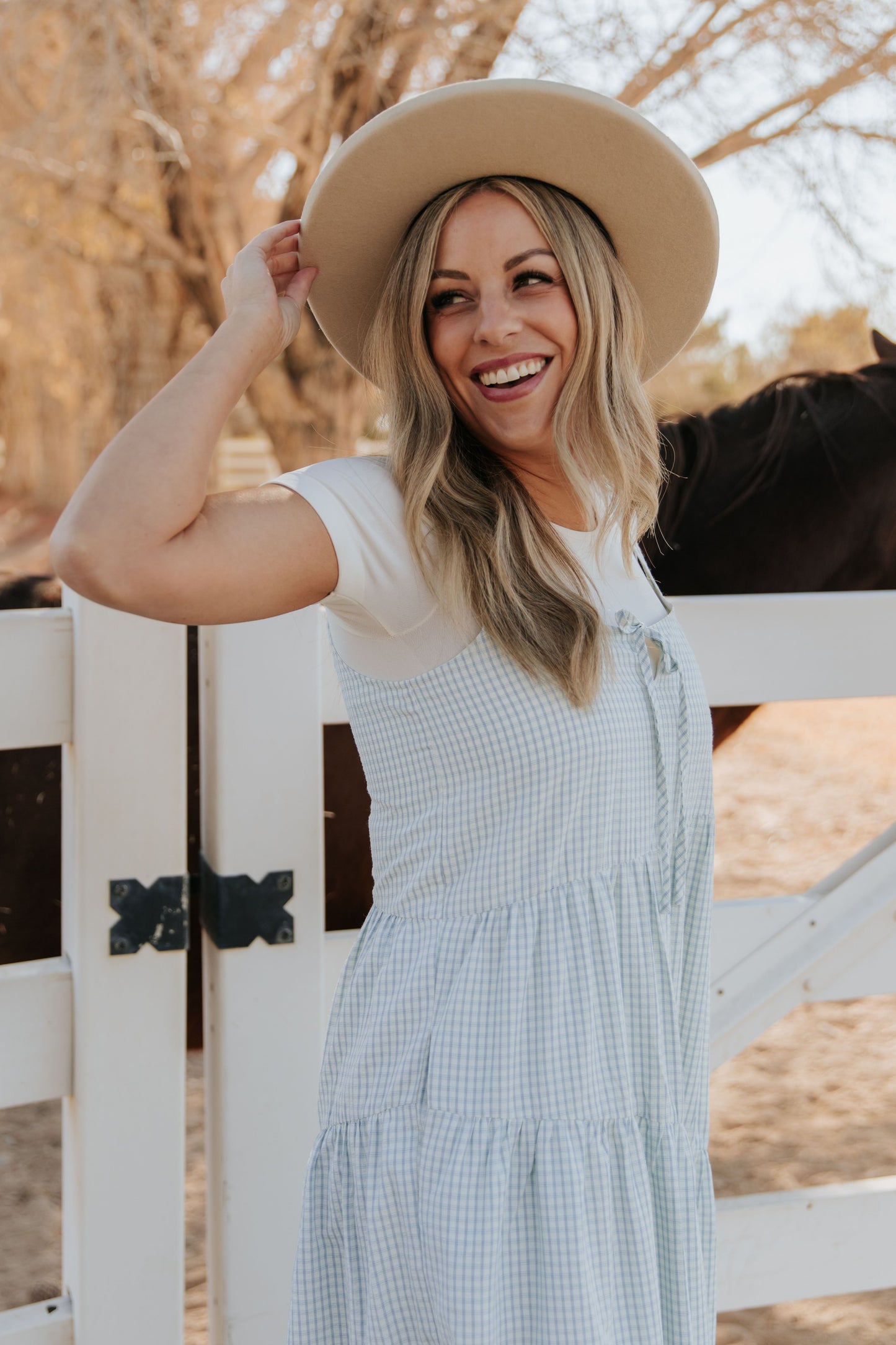 THE ALORA ASYMMETRICAL MIDI DRESS IN BLUE PLAID