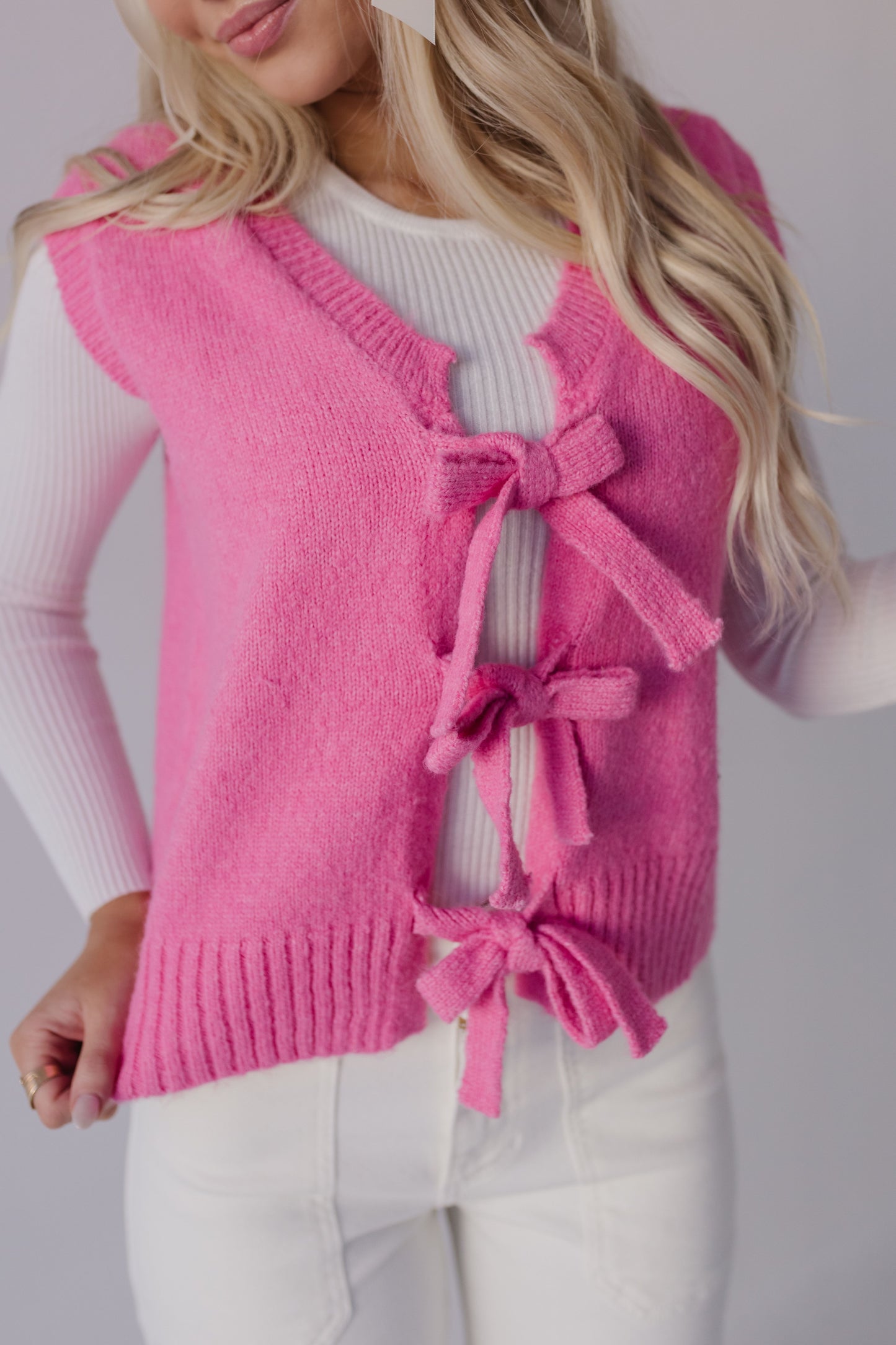 THE HOLLIS FRONT TIE SWEATER VEST IN HOT PINK