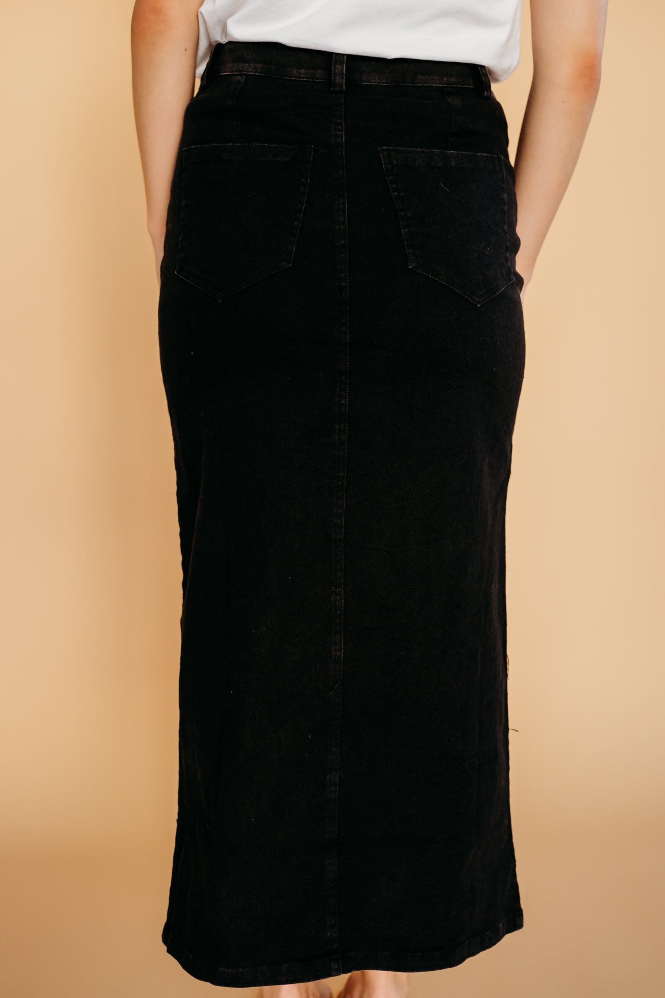 Custom-fit black denim skirt by Studio Heijne