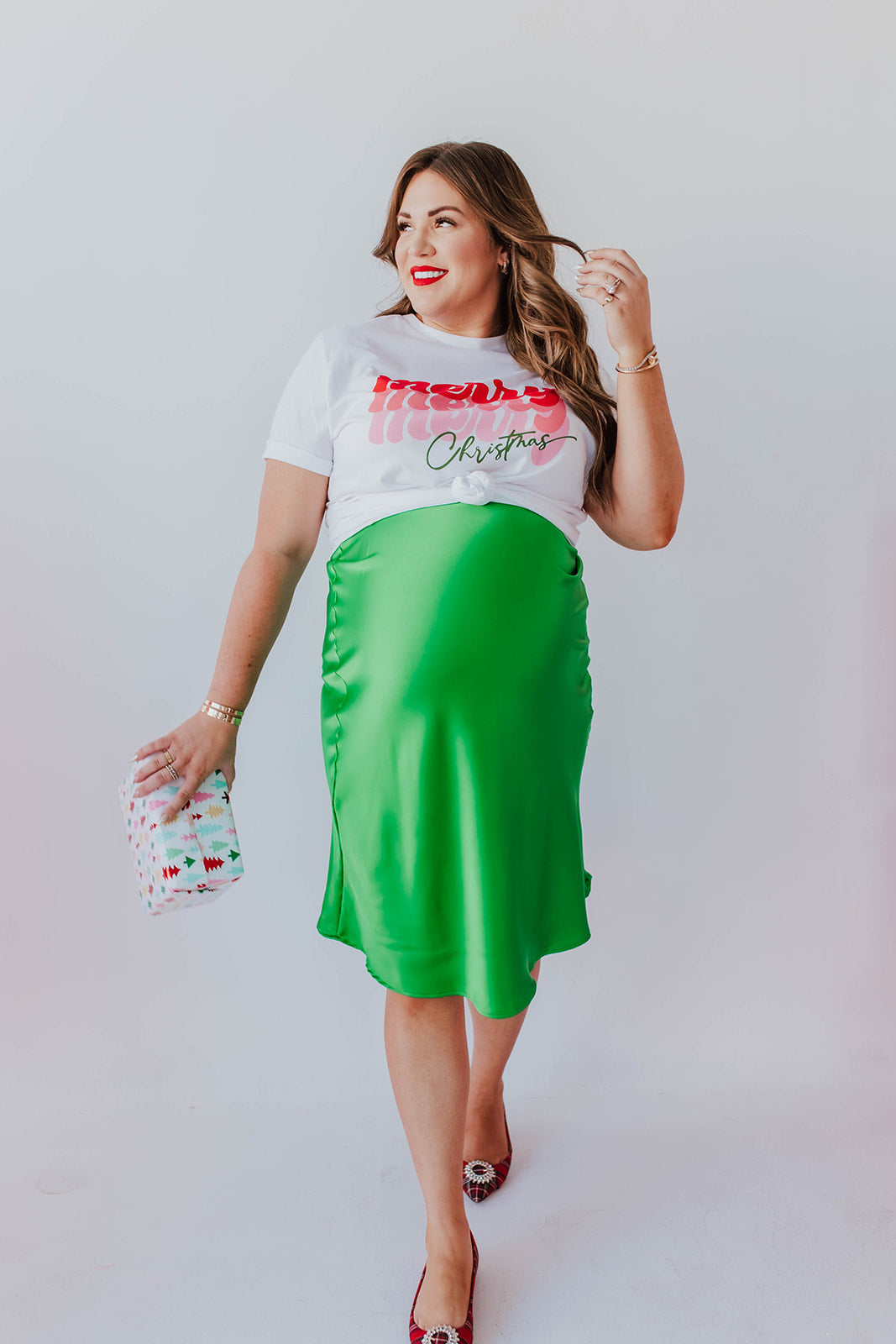 THE MISTLETOE SATIN MIDI SKIRT IN EMERALD GREEN