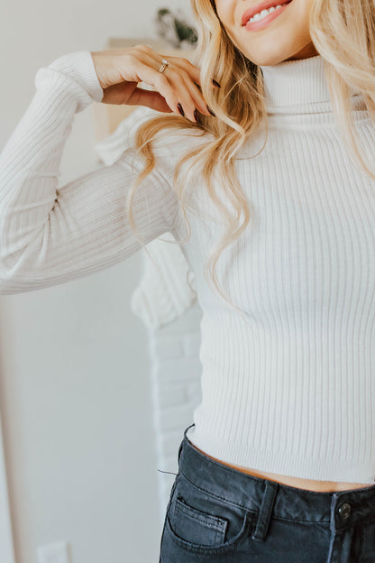 THE LUCIE TURTLENECK RIBBED SWEATER IN IVORY