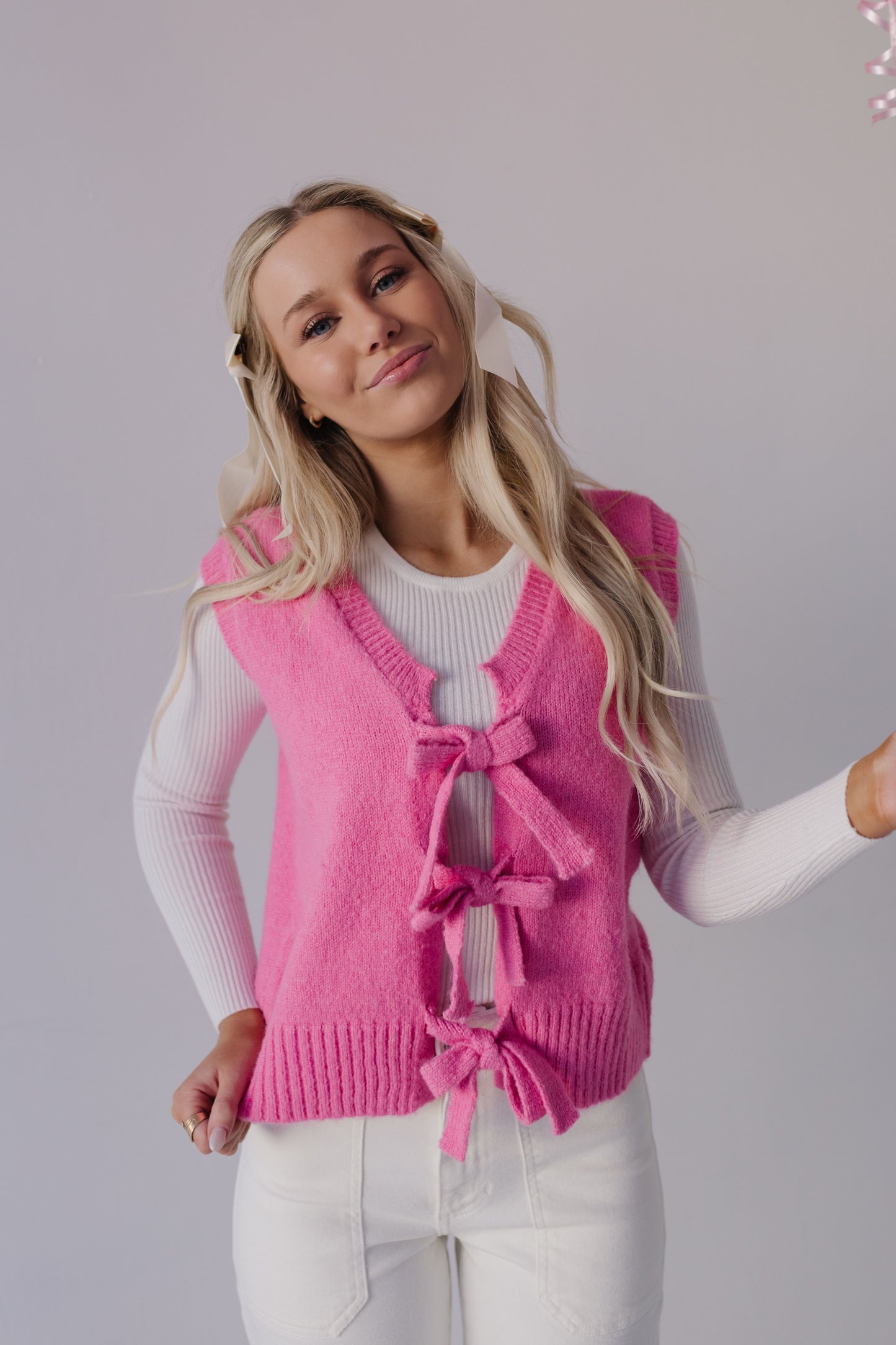 THE HOLLIS FRONT TIE SWEATER VEST IN HOT PINK