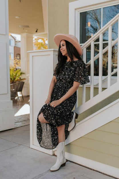 THE MEADOW PLEATED FLORAL MIDI DRESS IN BLACK