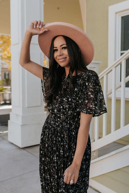 THE MEADOW PLEATED FLORAL MIDI DRESS IN BLACK