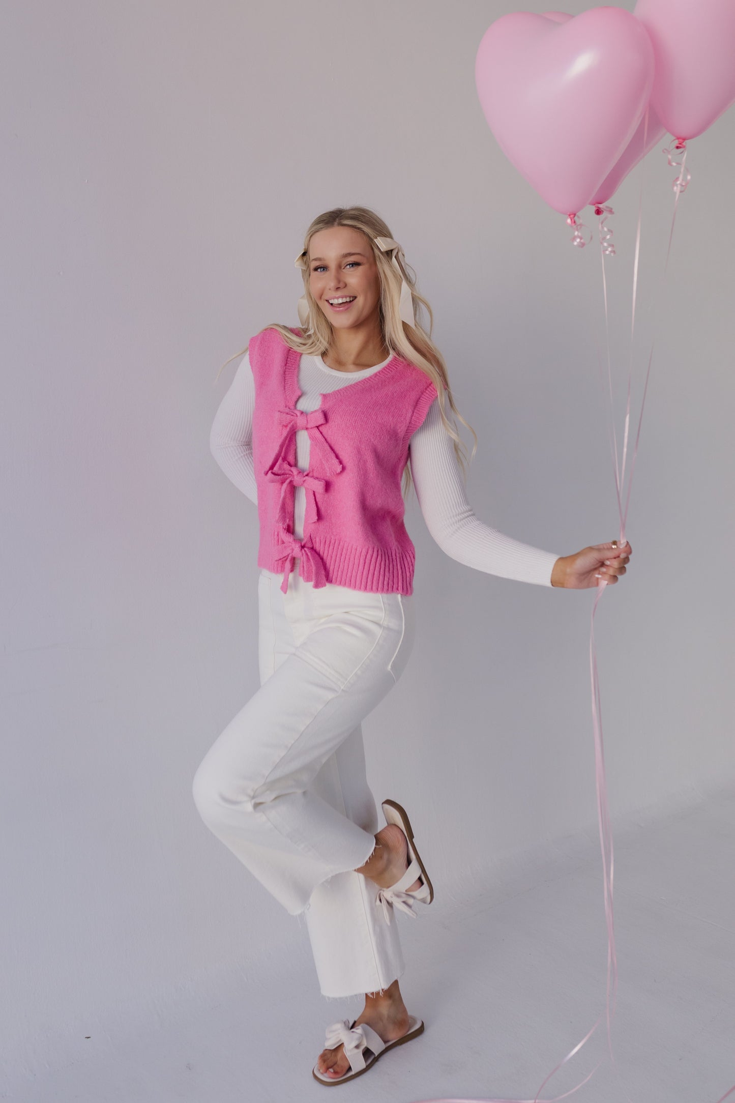 THE HOLLIS FRONT TIE SWEATER VEST IN HOT PINK