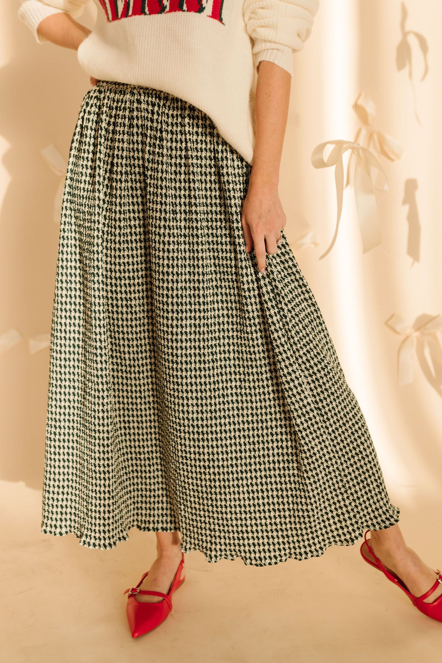 THE PRIM HOUNDSTOOTH MIDI SKIRT IN GREEN