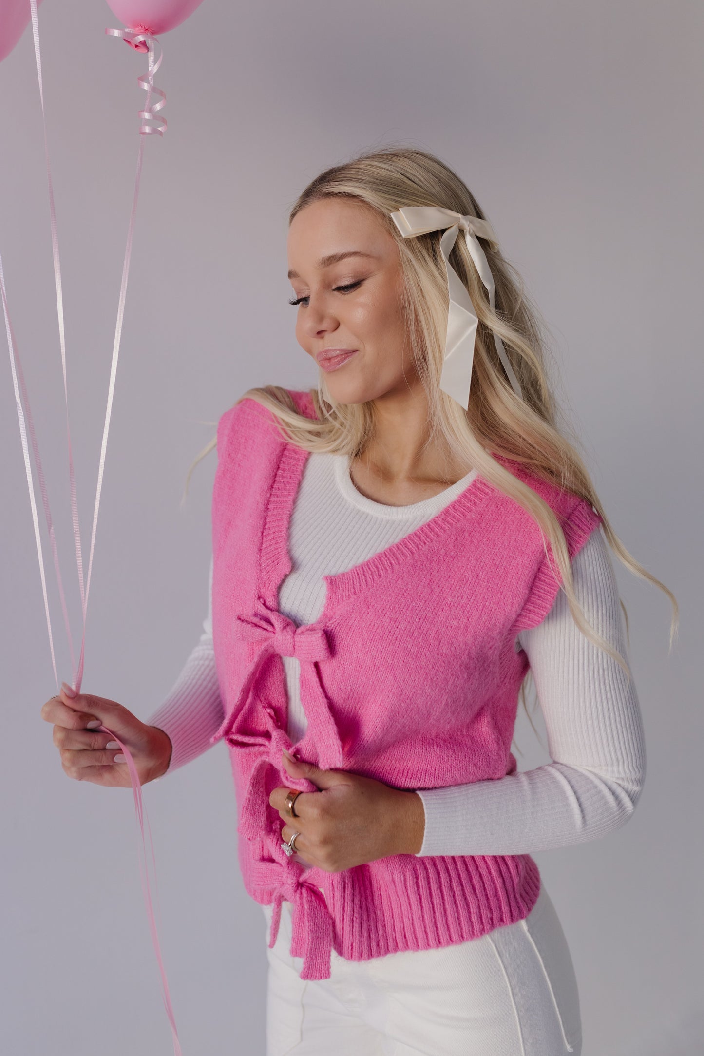 THE HOLLIS FRONT TIE SWEATER VEST IN HOT PINK