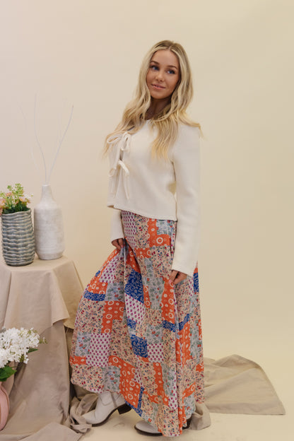 THE BRADYN PRINT MAXI SKIRT IN ORANGE