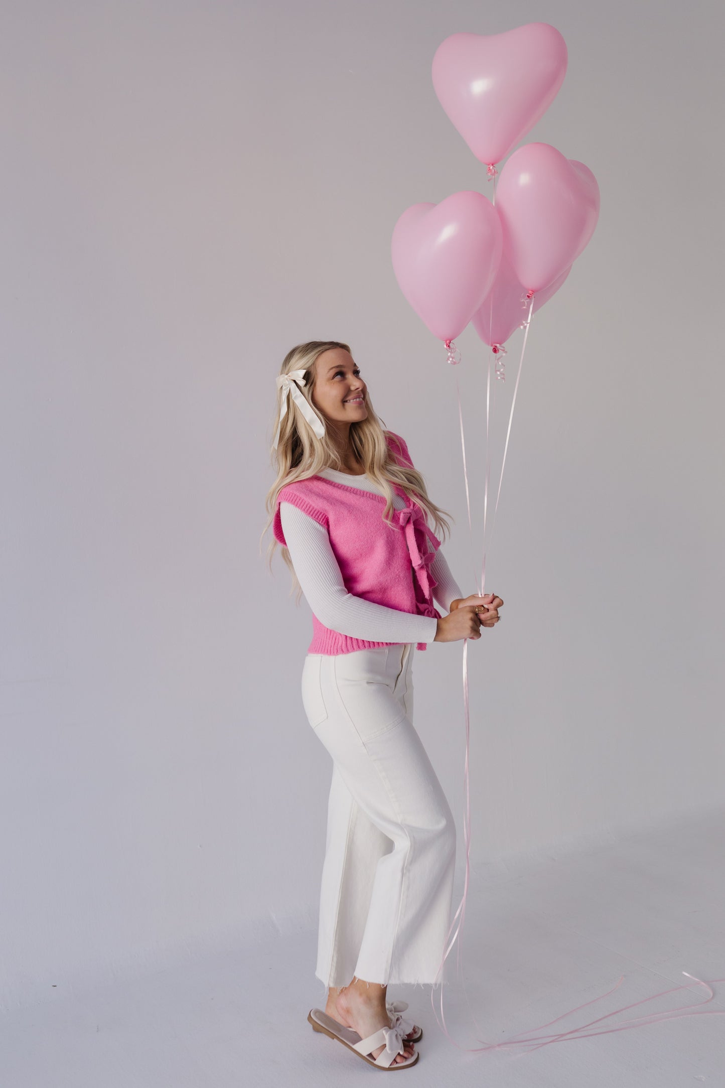 THE HOLLIS FRONT TIE SWEATER VEST IN HOT PINK