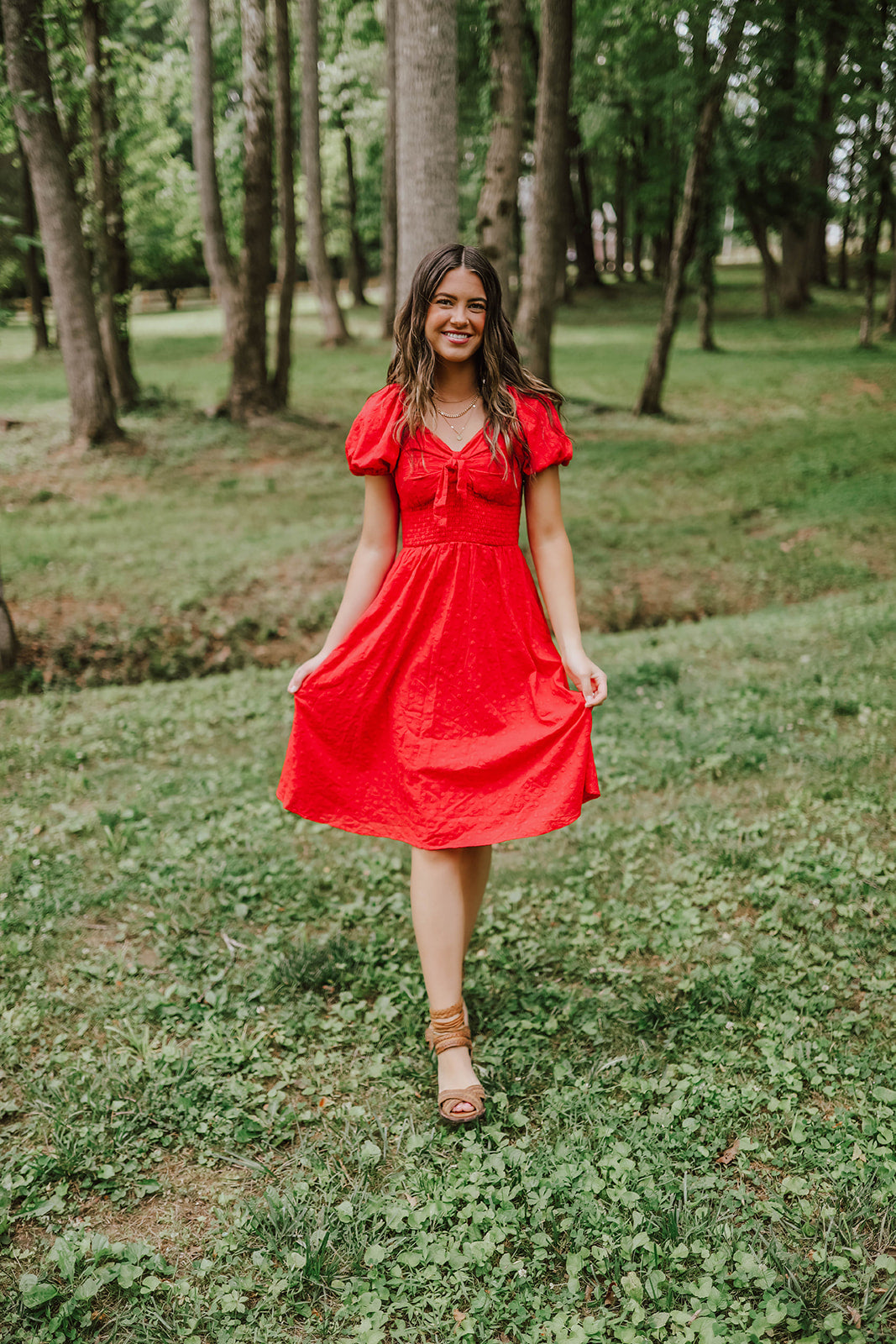 THE BETSY TIE FRONT EMBROIDERED DRESS IN RED BY PINK DESERT