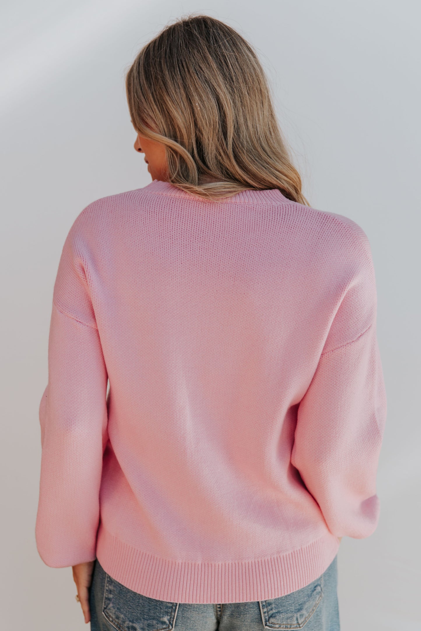 THE SALOME BOW TIE SWEATER IN PINK